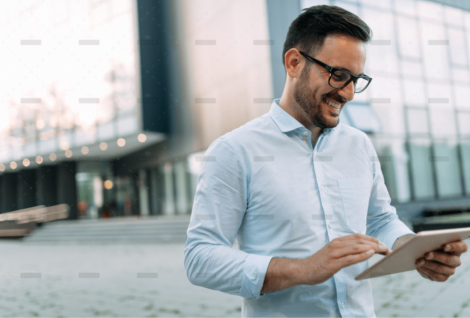 demo-attachment-1706-portrait-of-businessman-in-glasses-holding-tablet-AWVHCJU